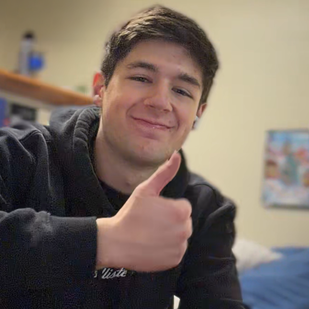 Gavin smiling and giving a thumbs up