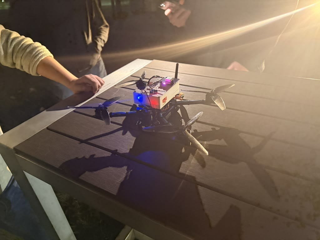 A Michigan Autonomous Security Team drone lit up during an outdoor test